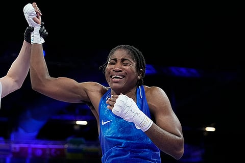 Refugee Olympic Team's Cindy Ngamba celebrates women's 75 kg preliminary boxing 